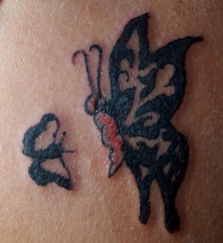 Shoulder tattoo, two butterflies flying