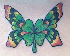 Four leaf clover with butterfly wings  tattoo