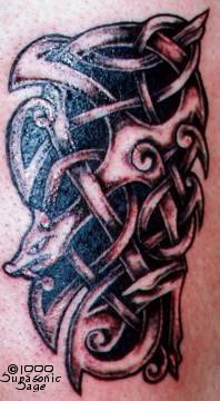 Celtic tracery with wolf head tattoo