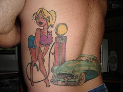 Blonde girl on car gas station tattoo