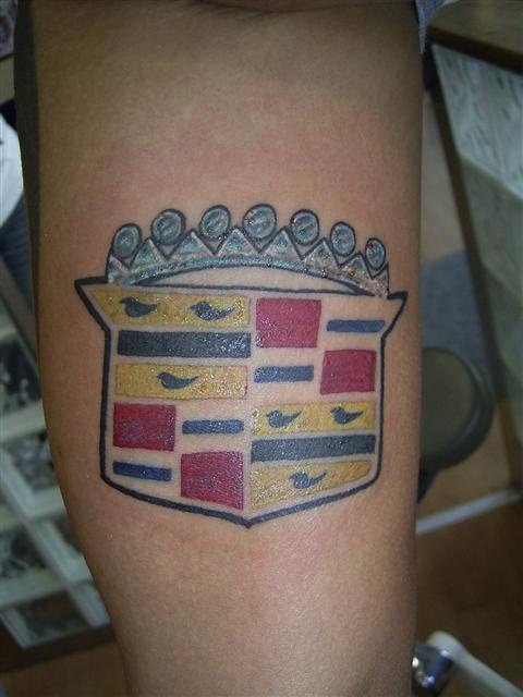 Cadillac logo coloured tattoo