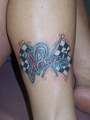 Nascar racing tattoo with flags