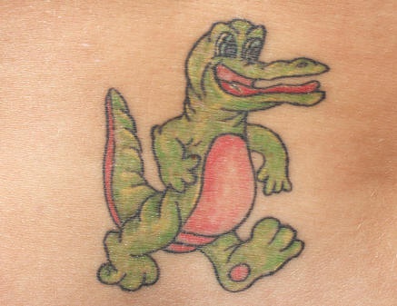 Cartoonish green alligator tattoo
