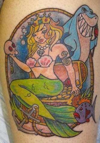 Cartoonish mermaid and shark tattoo