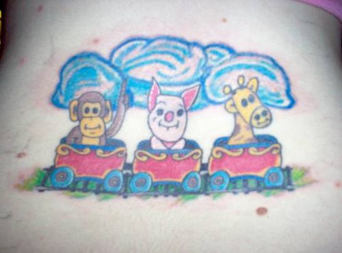 Cartoonish monkey pig and giraffe tattoo