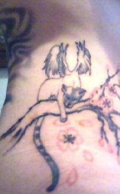 Winged cat on sakura tree tattoo