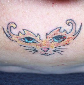 Coloured cat face tattoo
