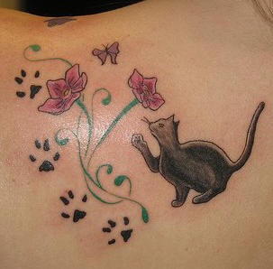 Black cat touching flowers tattoo
