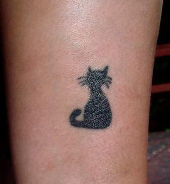 Minimalistic black cat silhouette tattoo