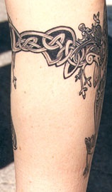 Celtic tracery tattoo on leg