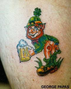 Green leprechaun with beer offers a kiss