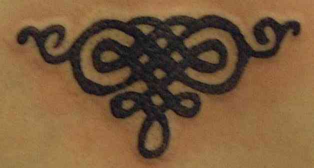 Simple celtic tracery tattoo
