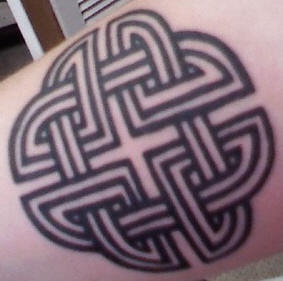 Four-cornered celtic knot tattoo on arm