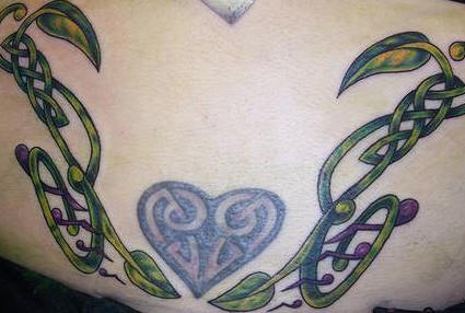 Celtic knot work vine tattoo with heart
