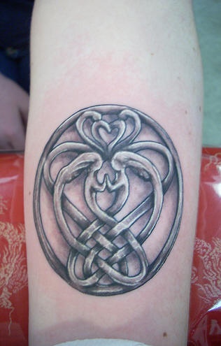 Celtic friendship symbol tattoo on forearm