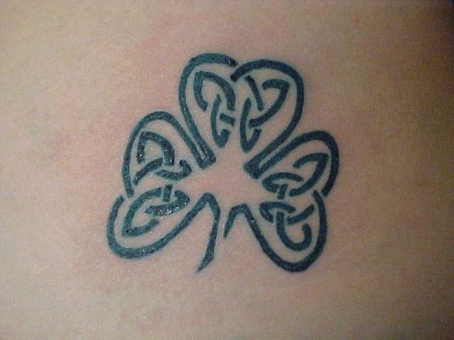 Celtic tracery clover tattoo