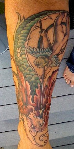 Cherub slaying dragon coloured tattoo