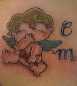 Cartoonish little cherub tattoo in colour