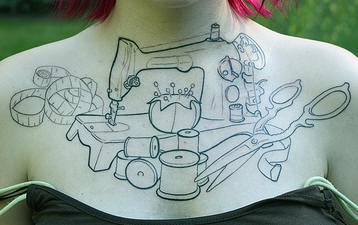 Sewing machine chest tattoo