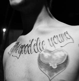 Die young chest tattoo