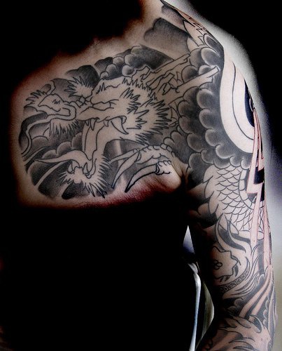 Evil dragon chest tattoo