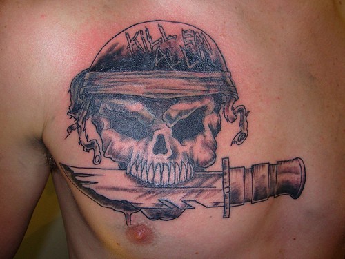Skull with knife chest piece tattoo picture