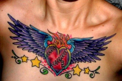 Burning heart chest tattoo