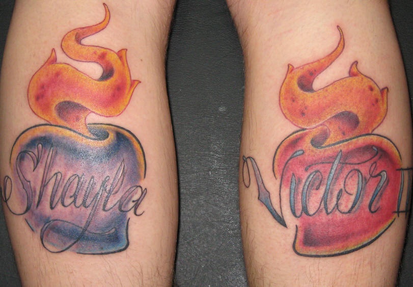 Blue and red sacred hearts tattoo