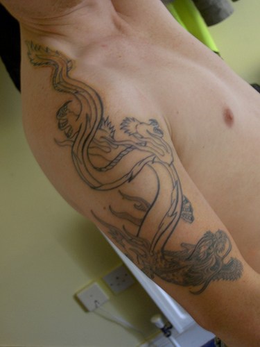 drago cinese incompleto tatuaggio