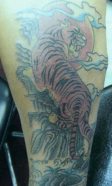 Chinese tiger on sunrise  tattoo