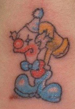 Cartoonish clown with hammer tattoo