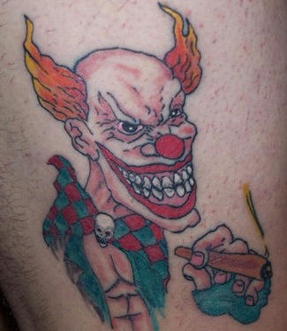 Fire haired clown with joint tattoo