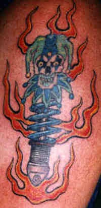 Insane clown toy in flame tattoo