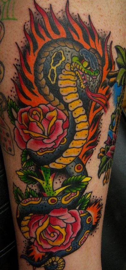 Flaming cobra snake with roses tattoo