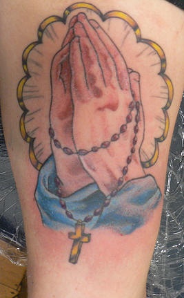 Praying hands tattoo in colour