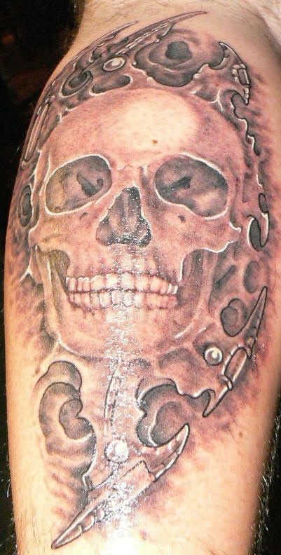 Realistic skull with tracery tattoo