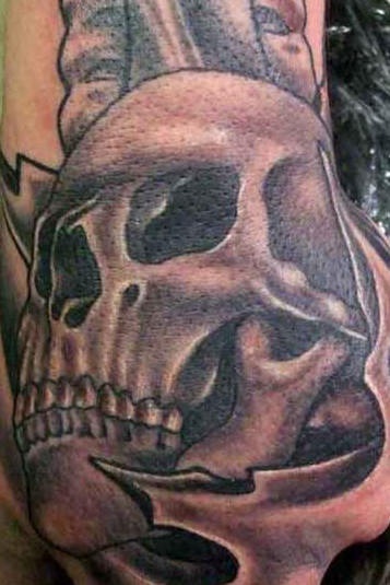 Highly detailed human skull tattoo