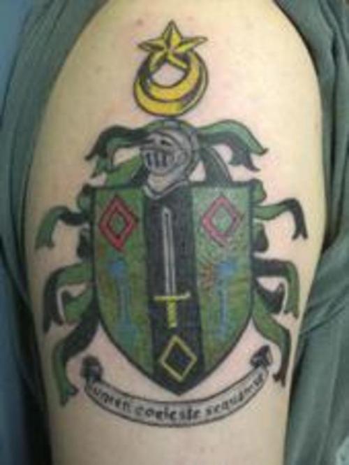 Green heraldic shield tattoo