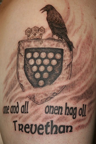 Heraldic shield with crown and raven tattoo