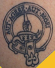 Aut agere aut mori in emblem tattoo