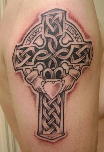 Celtic cross and heart in hands tattoo