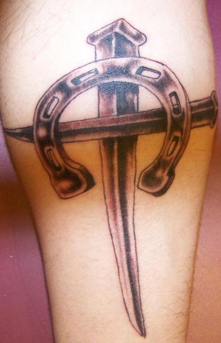 Iron cross and horseshoe tattoo