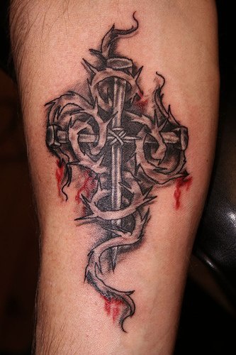 Bloody cross with thorns tattoo