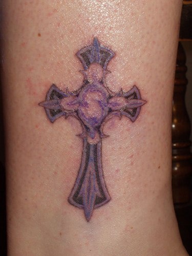 Purple cross with tracery tattoo