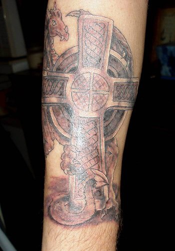 Cross tombstone with middle age dragon tattoo