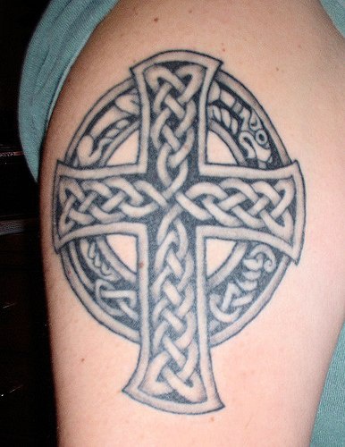 Cross tattoo with uroboros