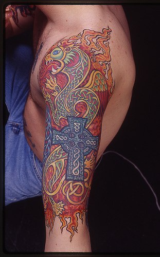 Middle age dragon and cross coloured tattoo