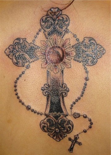 Cross rosarium black ink tattoo