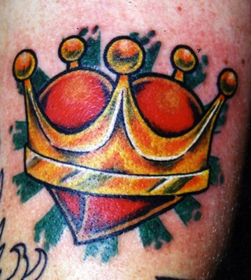 Colourful heart in crown tattoo