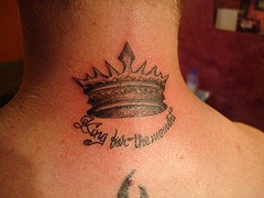 Crown black ink tattoo on neck